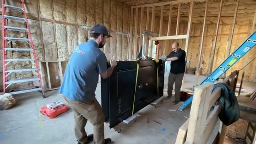 On The Mark Moving crew handling a piece on a San Antonio job
